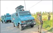  ?? ?? Security personnel stand guard near the encounter site, at the Tral area, in Pulwama on April 6.