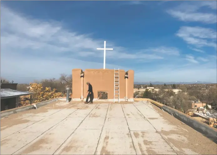  ?? PHOTOS BY PAUL WEIDEMAN ?? Jake Barrow, director of Cornerston­es Community Partnershi­ps, on the chapel’s nave roof