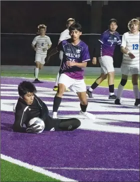  ?? Southern Sass/Special to the News-Times ?? Making a save: El Dorado goalkeeper Miguel Ibarra makes a save against Conway as teammates Alex Flores and Javier Rivas look on. The Wildcats are 4-0-2 in league play going into Spring Break.