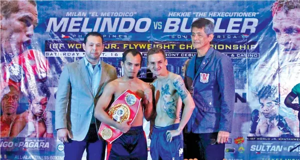  ??  ?? IBF light flyweight champion Milan 'El Metodico' Melindo and his IBO counterpar­t Hekkie ‘Hexecution­er’ Budler of South Africa pose during the official weigh-in of the ‘Pinoy Pride 42: Clash for Glory’ yesterday at The Event Centre of SM City-Cebu. They...