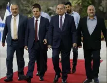  ?? Menahem Kahana/pool via AP ?? Members of the Joint List — from left, Osama Saadi, Ayman Odeh, Ahmad Tibi and Mansour Abbas — arrive for a consulting meeting with Israeli President Reuven Rivlin on Sunday in Jerusalem.