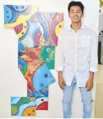  ??  ?? Cotabato graphic artist, costume designer, and choreograp­her John Michael Acol beside his artwork “Visages 1 (Sea if Fates)”