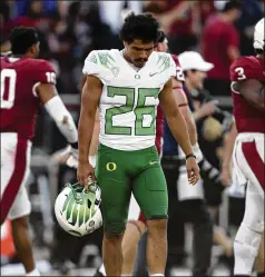  ?? JED JACOBSOHN/AP ?? Oregon running back Travis Dye can keep his head up despite losing to Stanford in OT this past Saturday. The Ducks’ early win at Ohio State could be enough to erase the negativity of this loss if they can win out.