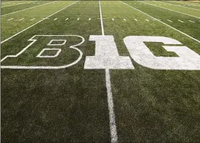  ?? Charlie Neibergall / Associated Press ?? The Big Ten logo is displayed on the field before a football game in Iowa City, Iowa.