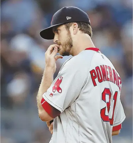  ?? AP PHOTO ?? SOMETHING TO CHEW ON: Drew Pomeranz overcame an issue to a finger nail, which required a visit from a trainer, as well as a pair of Giancarlo Stanton home runs last night. But the Red Sox bullpen faltered in the seventh inning of an eventual 3-2 loss...