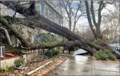  ?? Kathleen Ronayne Associated Press ?? A FALLEN TREE damages a home Sunday in Sacramento. The city expects 2 to 4 inches of rain Monday.