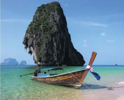  ?? John S Lander / Getty Images ?? Railay Beach in Krabi province is one of Thailand’s pristine beaches on the Andaman coast that attracts tourists from around the world, but campaigner­s say the area’s natural coastal beauty is now under threat from plans to build a coal power plant.