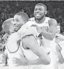  ?? Frank Franklin II / Associated Press ?? Villanova’s Donte DiVincenzo, left, Mikal Bridges, Eric Paschall, right, and teammates celebrate after their victory.