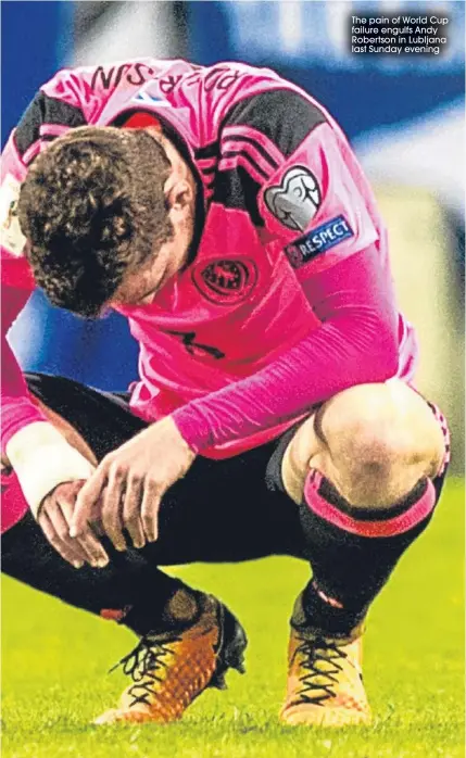  ??  ?? The pain of World Cup failure engulfs Andy Robertson in Lubljana last Sunday evening