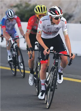  ?? BettiniPho­to ?? Tadej Pogacar, front, had been denied victory on Stage 3 by Adam Yates, but the UAE Team Emirates rider edged out Alexey Lutsenko in a thrilling battle on Thursday