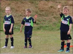  ??  ?? HIGH FIVES: Three soccer stars enjoying a break in play.