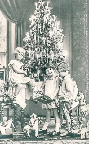  ?? ?? Clockwise from above left: happy children with gifts and vintage toys; workers at John Roger and Son preparing the poultry ahead of the Christmas rush in 1954; some festive illustrati­ons of a family decorating the tree from The Courier in 1934; and Santa Claus.