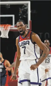  ?? Eric Gay / Associated Press ?? Kevin Durant, who led the U.S. with 29 points, won his third straight Olympic gold.