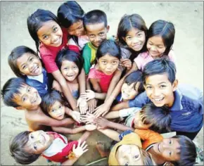  ?? SUPPLIED ?? A group of children enjoy a fun game during a child protection session coordinate­d by ChildFund Cambodia.