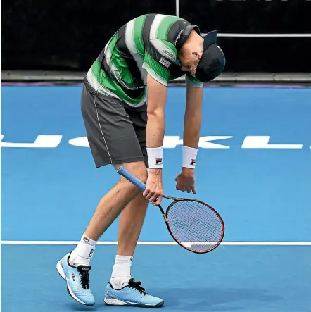  ?? PHOTOSPORT ?? John Isner’s body language says it all as he heads to defeat against fellow American Taylor Fritz.
