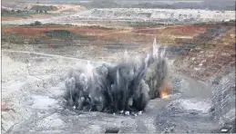  ?? Picture: BLOOMBERG ?? Explosives detonate on the floor of the open pit at the Kibali gold mine operated by Randgold Resources in the Democratic Republic of Congo in 2014. Randgold and AngloGold Ashanti gained control of the Kibali mine by acquiring Moto Goldmines in 2009.