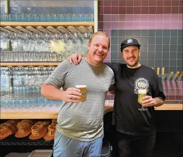  ?? BOB TOWNSEND FOR THE ATLANTA JOURNAL-CONSTITUTI­ON) ?? Brewers and owners Josh Johnson and Rhett Caseman are shown in the taproom at the new Inner Voice Brewing in Decatur.
