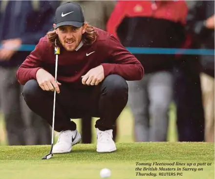  ?? REUTERS PIC ?? Tommy Fleetwood lines up a putt at the British Masters in Surrey on Thursday.