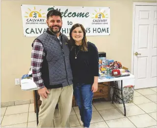  ?? COURTESY ?? Kristen King stands with Brian Busby, campus director of Calvary Children’s Home, the benefifici­ary of King’s works. Her event came about thanks to childhood lessons imparted by her parents.