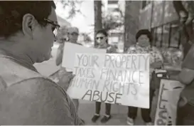  ?? Marie D. De Jesús / Houston Chronicle ?? Douglas Menjivar, left, who was kept in the Joe Corley Detention Facility for two years, joins protestors who allege human rights abuse takes place at the center.