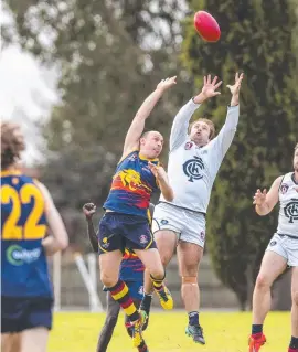 ?? Picture: Kevin Farmer ?? FLYING HIGH: University’s Ben Tiller (left) and Coolaroo’s Thomas Claydon compete for the ball during round two of the AFL Darling Downs Allieds Cup. Coolaroo play host to Goondiwind­i today – first bounce is 2.30pm.