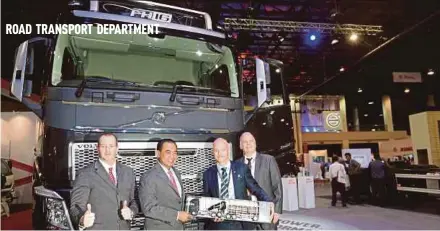  ?? PIC BY ROSELA ISMAIL ?? Deputy Transport Minister Datuk Abdul Aziz Kaprawi (second from left) at the Malaysia Commercial Vehicle Expo (MCVE) 2017 in Seri Kembangan yesterday.