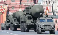  ??  ?? Deadly cargo . . . Russian servicemen drive Yars RS24 interconti­nental ballistic missile systems during the parade.