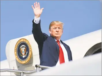  ?? Mandel Ngan / AFP / Getty Images ?? President Donald Trump boards Air Force One at Morristown Municipal Airport in Morristown, N. J., on Saturday, en route to a rally in Ohio.