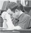  ?? Dale G. Young / Associated Press ?? Larry Nassar listens to the statement by a victim Tuesday in a Michigan courtroom.