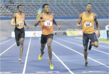  ?? (Photo: Observer file) ?? TAYLOR (centre)... all eyes on promising athlete