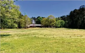  ?? COURTESY ?? The Vermack Road property that Dunwoody agreed to purchase last week encompasse­s about 9.3 acres, including this open field and adjacent wooded area.