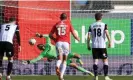  ?? Photograph: Simon Stacpoole/Offside/Getty Images ?? Ben Foster saves Cedwyn Scott’s penalty to break Notts County hearts but they joined Wrexham back in the EFL after winning the playoffs.