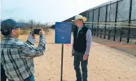  ??  ?? Land Commission­er Aubrey Dunn put up a ‘no trespassin­g’ sign in March along a section of the U.S.-Mexico border that is state trust land. He said the federal government did not obtain the right of way to use the property for a road and fence.