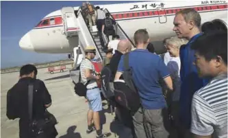  ?? —AP ?? PYONGYANG: In this June 27, 2015, file photo, passengers board an Air Koryo plane bound for Beijing, at the Pyongyang Internatio­nal Airport.