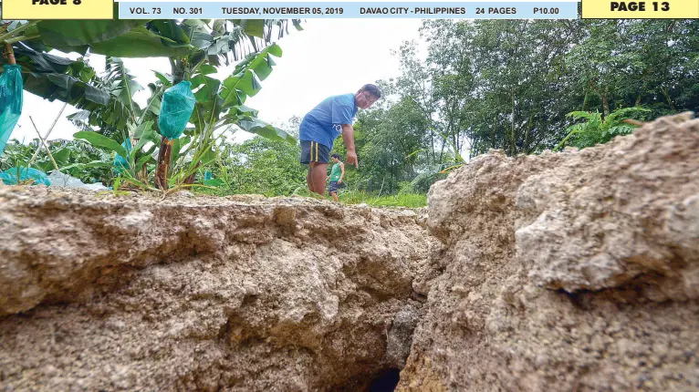  ?? BING GONZALES ?? PAT BEOYO Jr. of Barangay Pangayasan, Makilala, North Cotabato shows cracks in their area after the Oct. 31 earthquake, the third major shake in less than a month that hit several parts of Mindanao.