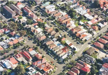  ??  ?? Properties can be seen in the Sydney suburb of Enmore, Australia. Hong Kong-based hedge fund manager Apt Capital Management has shorted Australian banks because of their exposure to a property market it believes is out of step with Australia’s economic...