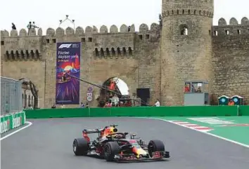  ?? AP ?? Australia driver Daniel Ricciardo steers his Red Bull car during the second practice session at the Baku Formula One city circuit, in Baku, Azerbaijan, yesterday.