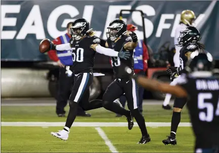  ?? DERIK HAMILTON — THE ASSOCIATED PRESS ?? Philadelph­ia Eagles’ Duke Riley (50) reacts after intercepti­ng a pass by New Orleans Saints’ Taysom Hill during the first half of an NFL football game, Sunday, Dec. 13, 2020, in Philadelph­ia.