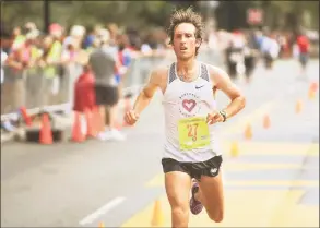  ?? Brian A. Pounds / Hearst Connecticu­t Media ?? Everett Hackett, of Hartford, crosses the line as the top Connecticu­t finisher at the New Haven Road Race national championsh­ip 20K on Monday.