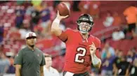  ?? TAMPA BAY TIMES ?? Bucs quarterbac­k Kyle Trask warms up as offensive coordinato­r Byron Leftwich, left, watches before a game against the Baltimore Ravens in October at Raymond James Stadium.