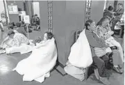  ?? Shohei Miyano / Kyodo News via Associated Press ?? Hotel guests gather in the lobby after being evacuated from their rooms following an earthquake early Saturday in Kumamoto, Japan.