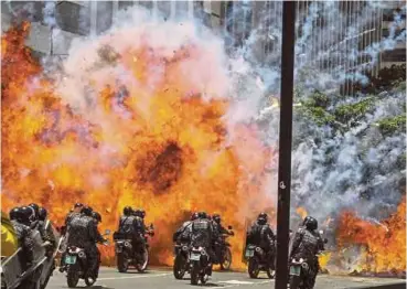  ?? EPA PIC ?? A blast from an improvised explosive targeting a police motorcycle convoy in Caracas on Sunday.