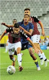  ?? /GRANT PITCHER/GALLO IMAGES ?? Houari Baouche of USM Alger tackled by Taahir Goedeman of Cape Town City during their CAF Confederat­ion Cup.