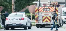  ?? | HOLLY HART/ THE NEWS- GAZETTE VIA AP ?? Police man the perimeter of a shooting in Champaign on Sunday. One man was killed and four other people were wounded in a pair of shootings early Sunday.
