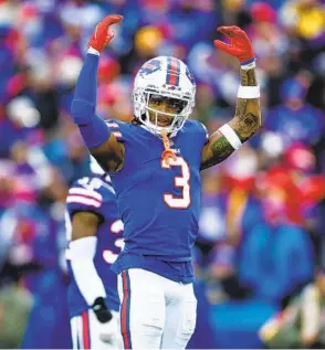  ?? ISAIAH VAZQUEZ GETTY IMAGES ?? There won’t be better NFL news this year than Damar Hamlin, shown pumping up Bills fans against the Vikings, having his breathing tube removed and talking to teammates.