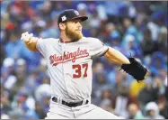  ?? Jonathan Daniel / Getty Images ?? The Nationals’ Stephen Strasburg pitches in the second inning of Game 4 of the National League Division Series against the Cubs at Wrigley Field. Strasburg went seven shutout innings, striking out 12, to earn the win.