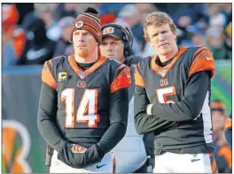  ?? VICTORES/THE ASSOCIATED PRESS] [FRANK ?? Bengals quarterbac­ks Andy Dalton (14) and Ryan Finley stand on the sidelines during the game against the Pittsburgh Steelers, Nov. 24 in Cincinnati.