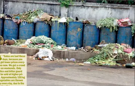  ??  ?? Destinatio­n garbage bins: Excess vegetables being thrown away at the Narahenpit­a Economic Centre.
Pix by Indika Handuwala and Susantha Liyanawatt­e