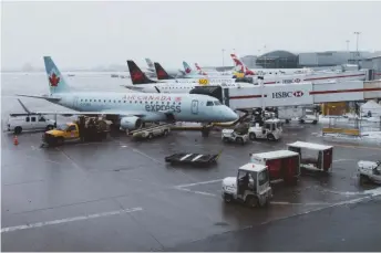  ?? David Preston, Unsplash photo ?? Air Canada and other carriers at passenger gates at Toronto’s Pearson Internatio­nal, the country’s busiest airport. Canada needs to get those planes flying again as part of a post-pandemic recovery, writes Karl Moore.