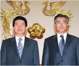  ??  ?? Moon Jae-in poses with the late President Roh Moo-hyun after being appointed senior presidenti­al secretary for civil affairs in 2004.